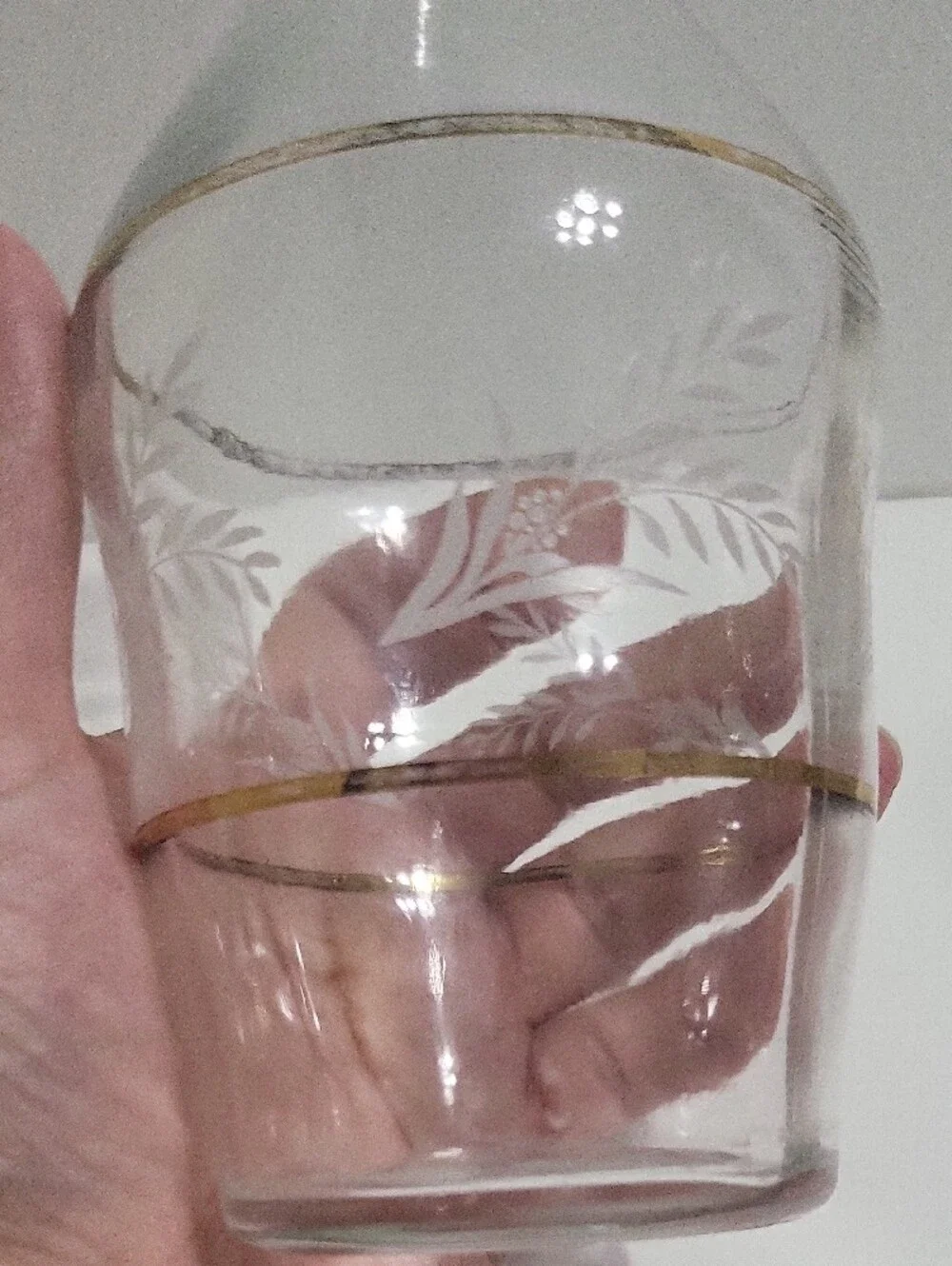 Clear Glass Decanter with Gold Accent and Leaf Etching.